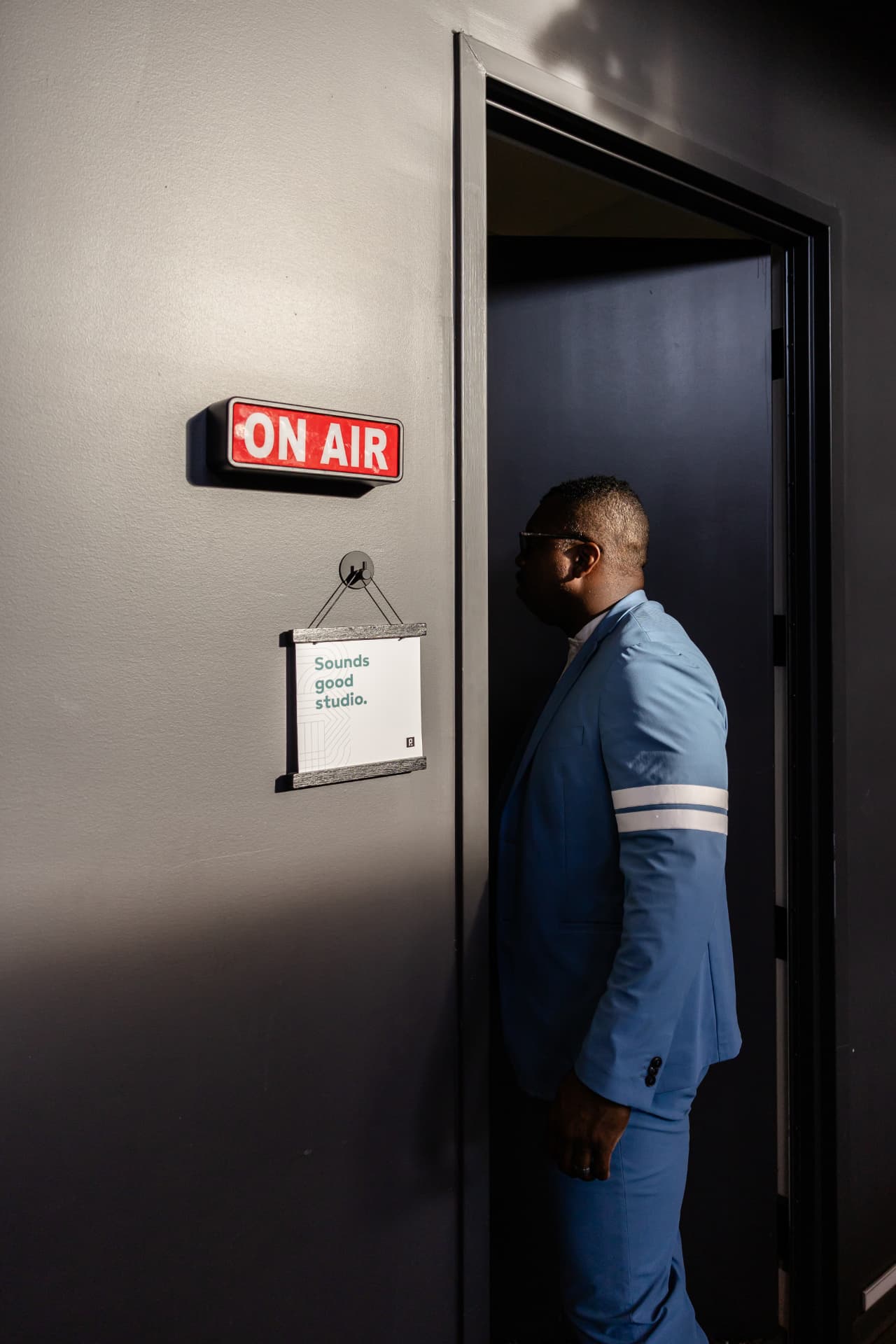 Jason O'Neal walking into a podcast studio